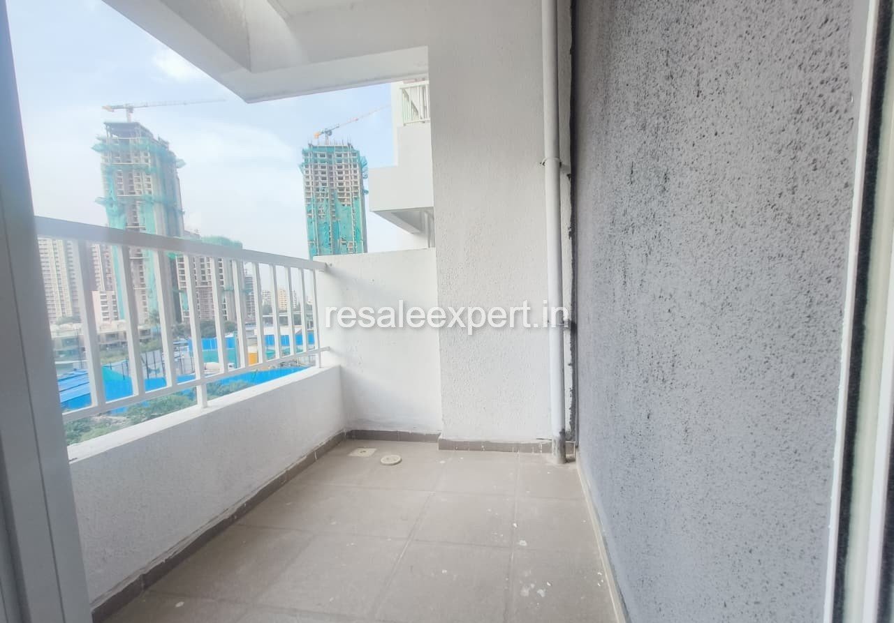 Spacious balcony area with railing and open skyline view