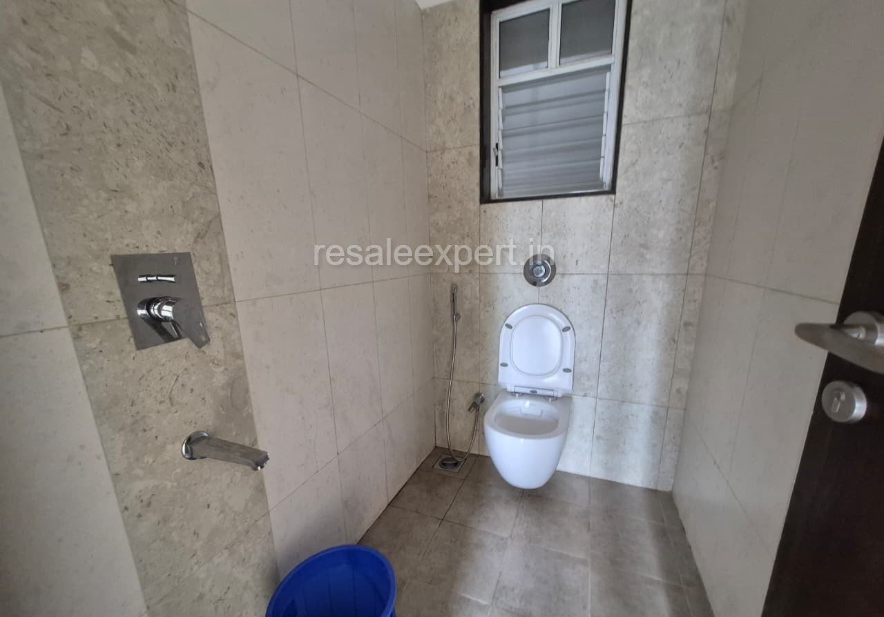 Neat and functional bathroom setup in ready possession 2 BHK flat Wakad