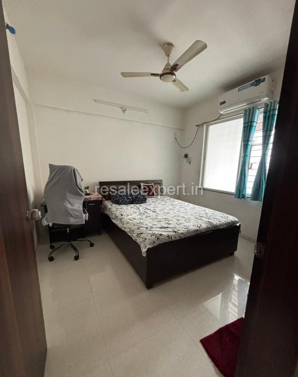 Comfortable secondary bedroom in semi-furnished 2.5 BHK apartment Pimple Nilakh