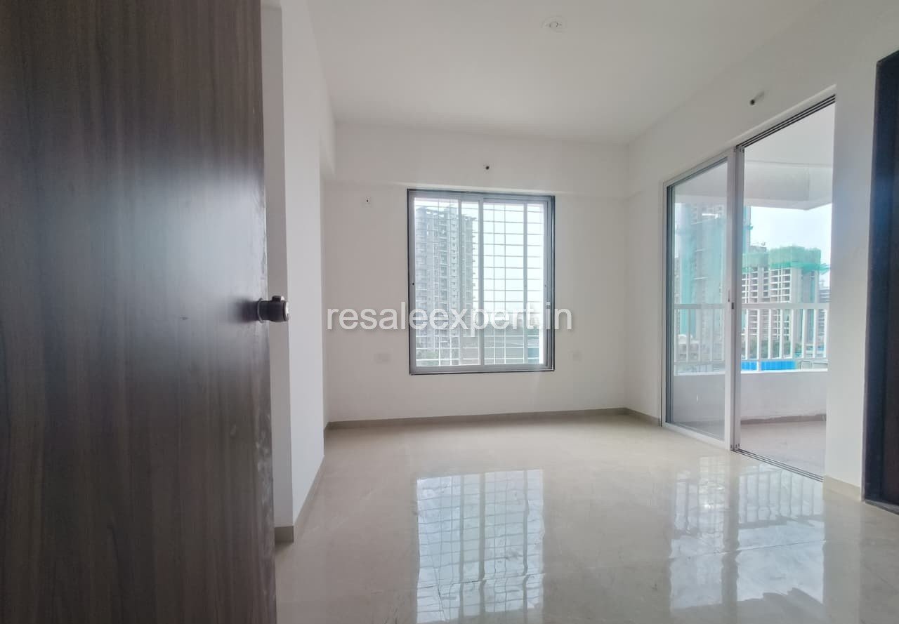 Cozy master bedroom with balcony access in 2 BHK flat in Tathawade