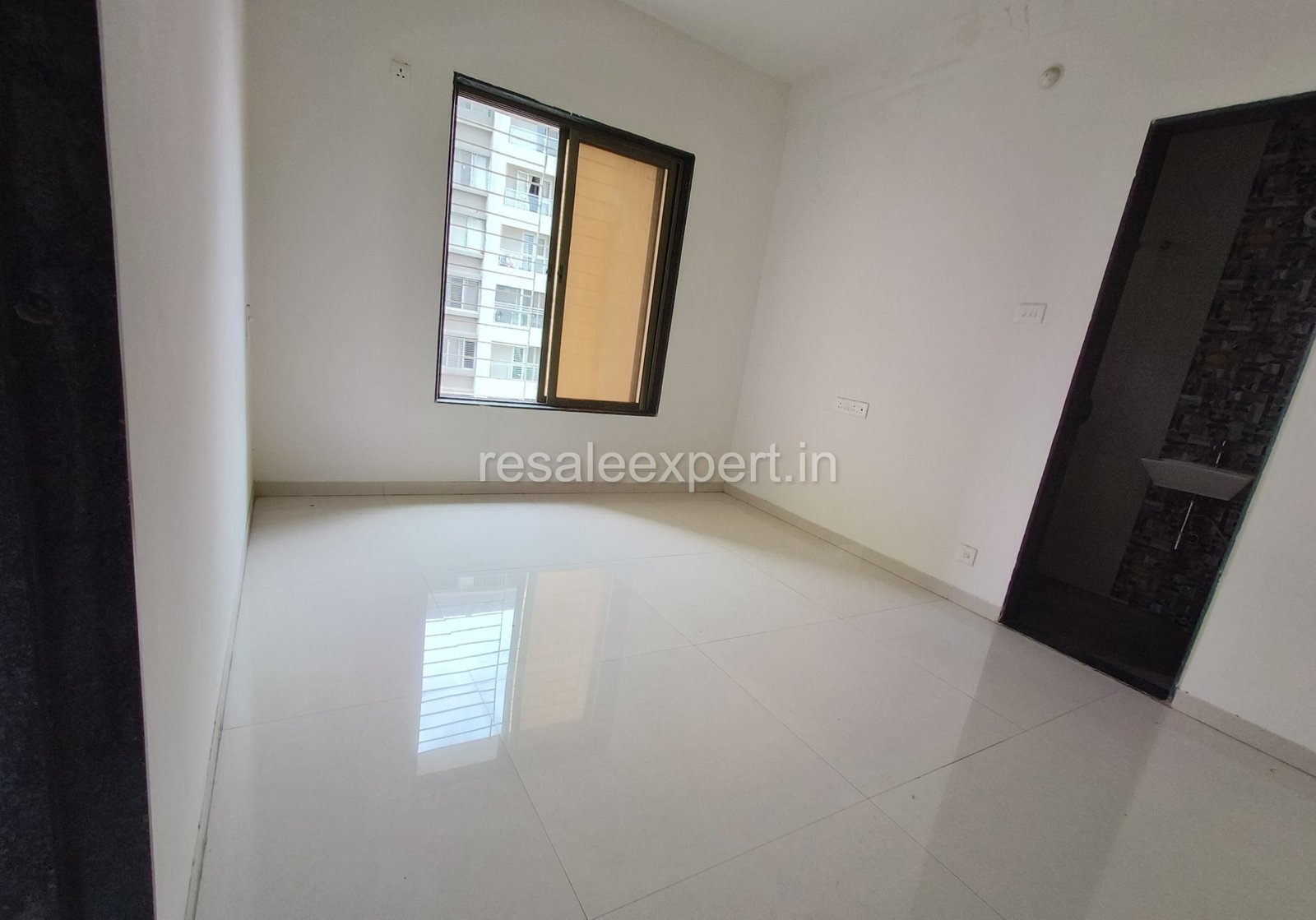 Master bedroom with ample sunlight in 3 BHK flat for sale in Pimpri
