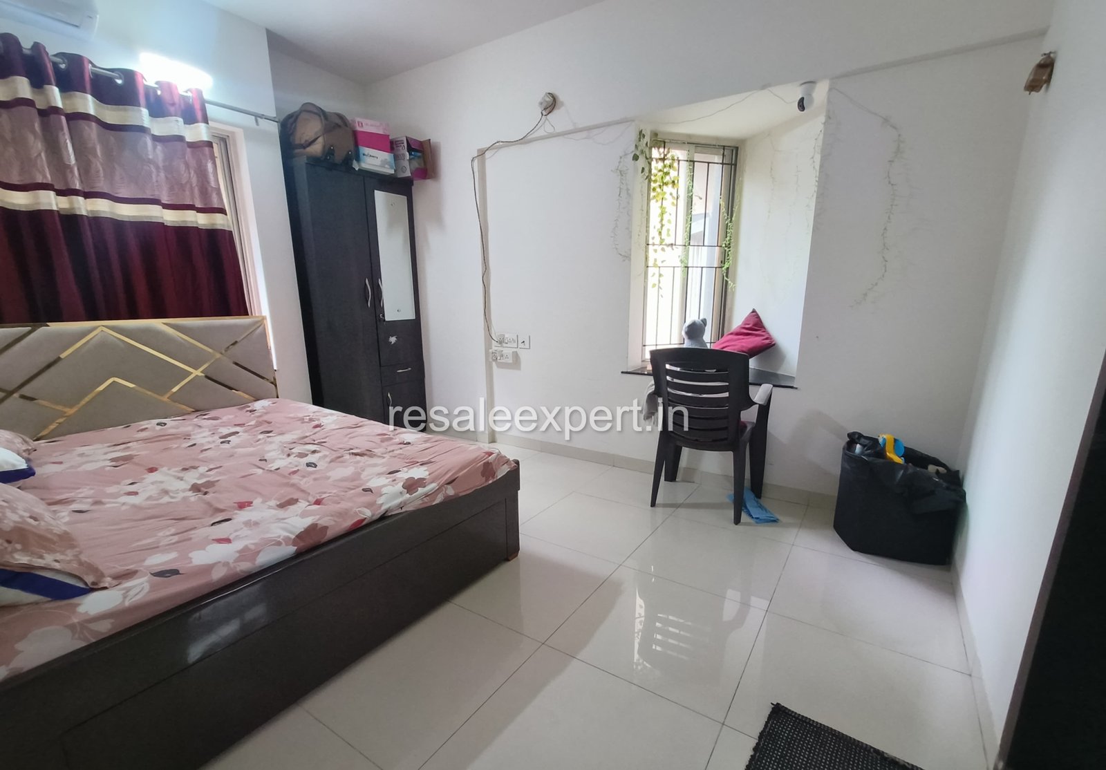 Cozy and well-lit master bedroom in Rahatani flat for sale
