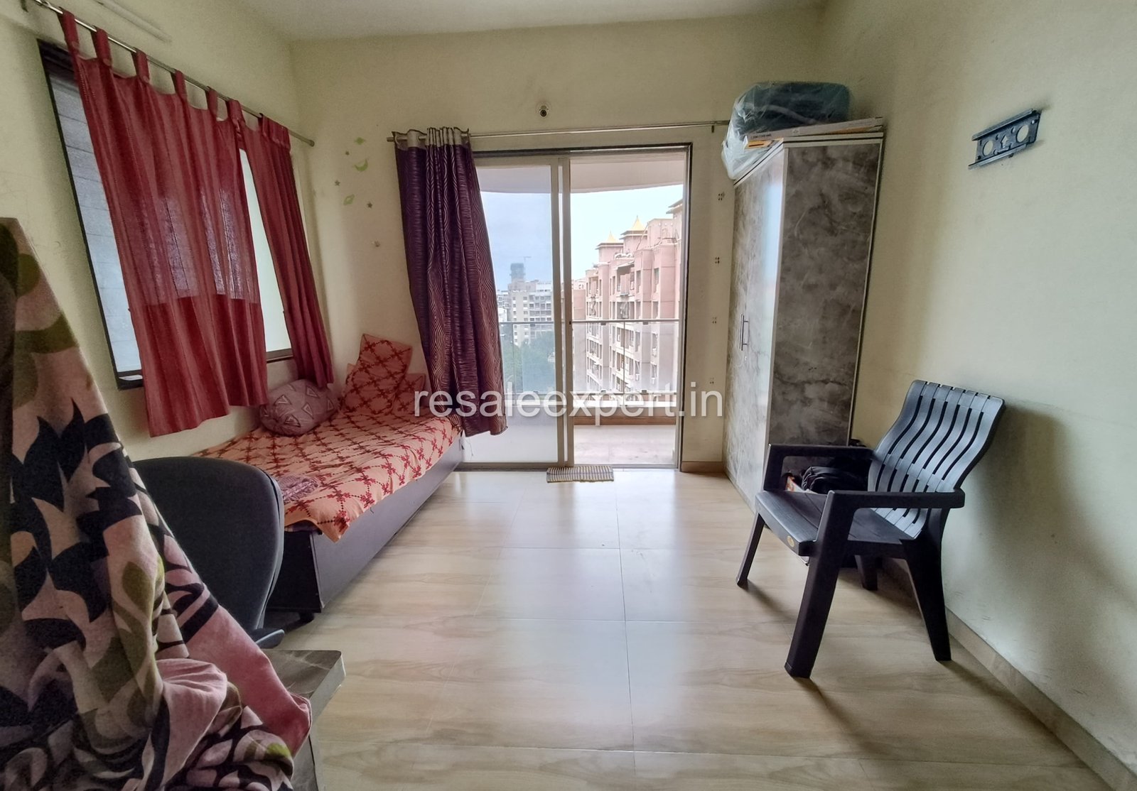 Garden-facing master bedroom in Rahatani 2 BHK Flat with Immediate Possession
