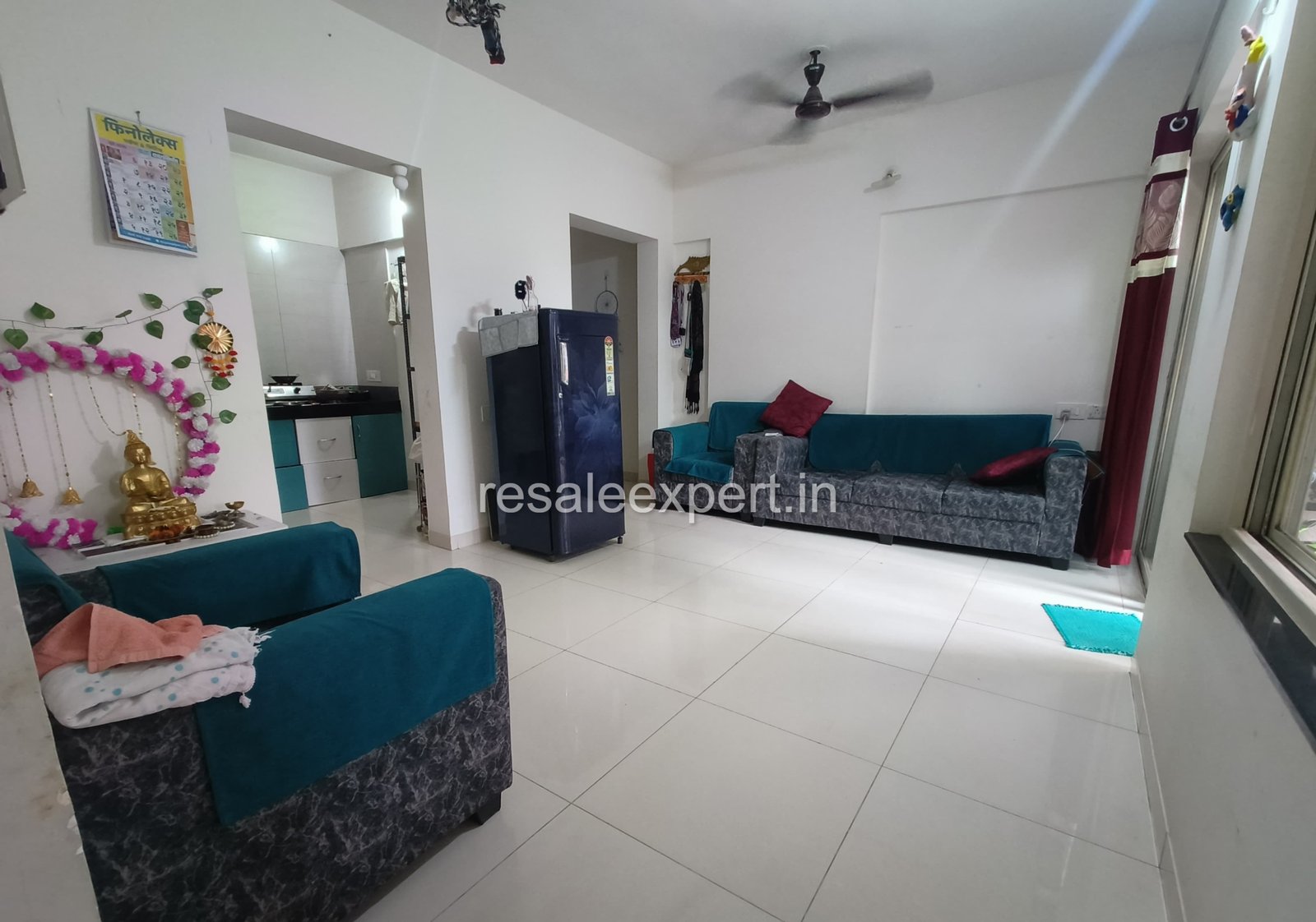 Spacious living hall of 2 BHK flat in Rahatani with natural lighting