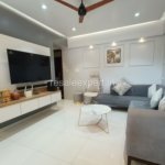 Neatly furnished hall with ample natural light