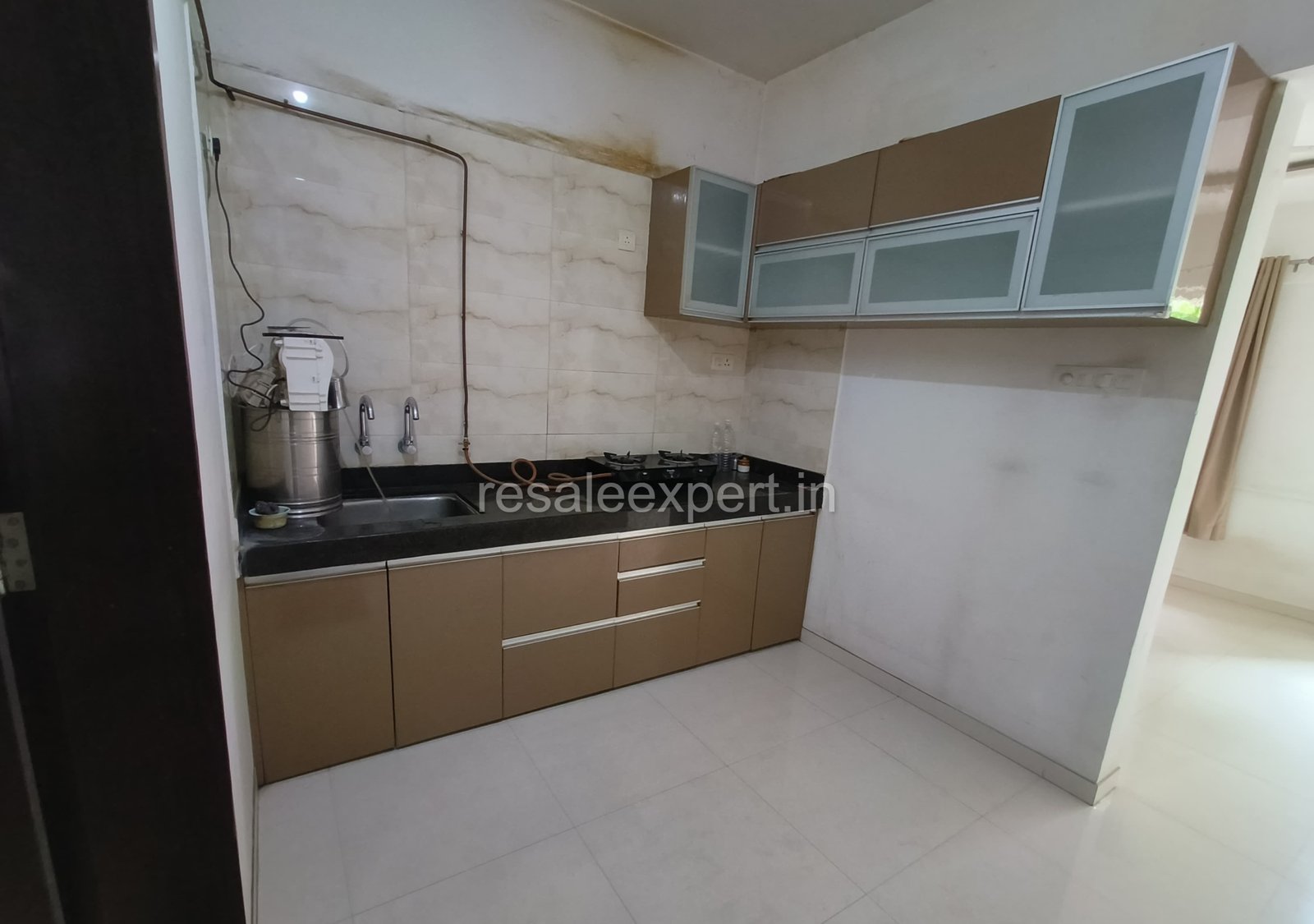 Semi-furnished kitchen area in a ready-to-move 2 BHK flat in Rahatani