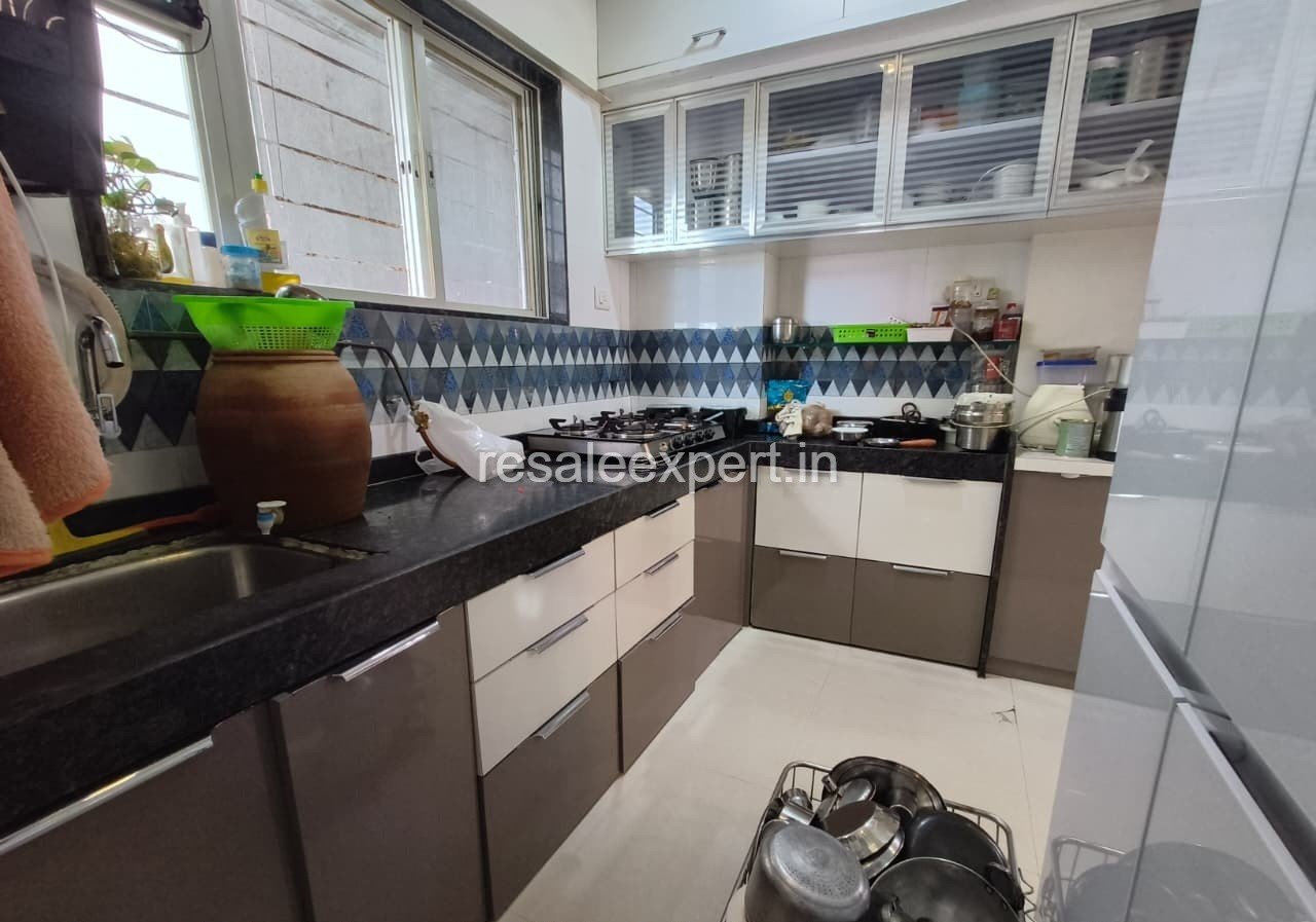 Modern kitchen area of 2 BHK Furnished Flat in Rahatani
