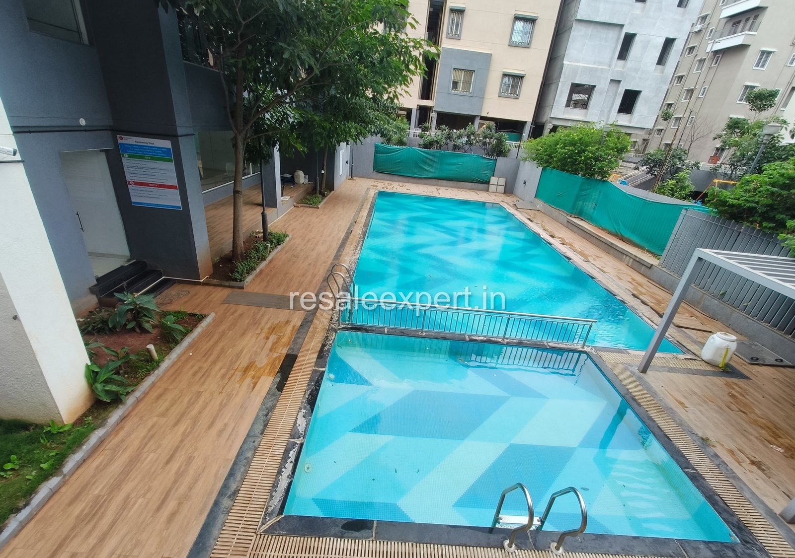 Well-maintained swimming pool with deck in Rahatani project